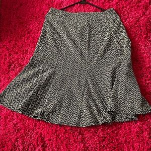 Knee length Flare skirt. Has been altered to fit size 10.